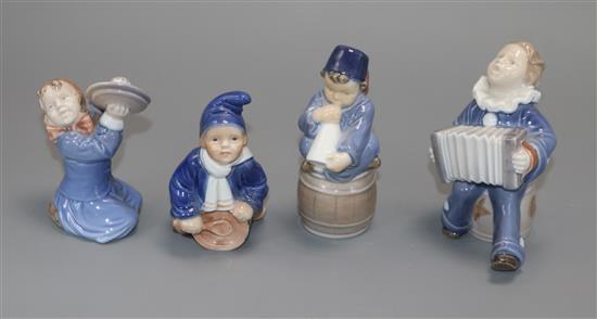 Four Royal Copenhagen models of children playing musical instruments, numbers 3677 (2), 148 and 3689 tallest 11cm